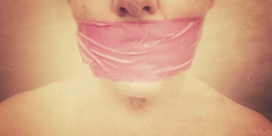 image of woman with tape over her mouth for Masturbation Monday week 234